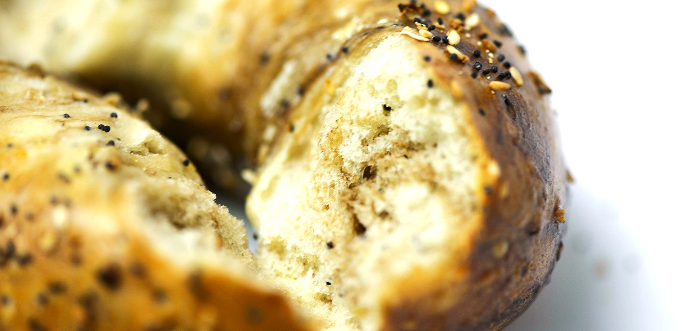 A torn everything bagel up close